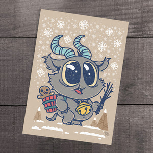 A whimsical holiday greeting card featuring an adorable "Lil' Krampus" cartoon monster with blue fur and curled horns, carrying a hot beverage and a stick, with snowflakes falling around, all by Chris Ryniak.