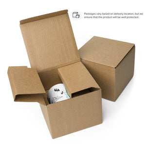 A neatly opened cardboard package revealing a Bindlewood Shop Good Mourning Mug with decorative patterns inside, illustrating secure packaging for safe delivery.