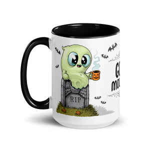A Halloween-themed ceramic mug featuring a cute cartoon ghost sitting on a tombstone, holding a little orange mug, with the phrase "Good Mourning" and tiny flying bats in the background. This dishwasher.