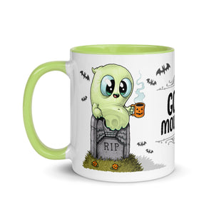 A cute green cartoon ghost designed by Chris Ryniak, holding a Bindlewood Shop Good Mourning Mug with a pumpkin design, sitting atop a tombstone that says "rip," with the phrase "ghoul morning" to.