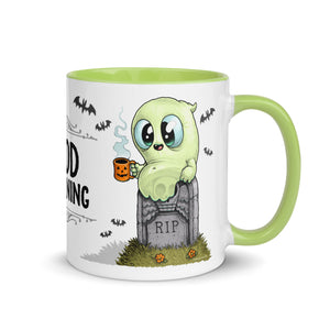 A cute cartoon ghost sipping from a mini mug while perched on a tombstone, with the phrase "dead morning" above it, on a ceramic Halloween-themed coffee mug designed by Chris Ryn called the Good Mourning Mug from Bindlewood Shop.