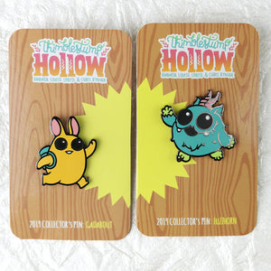 Two High Five Enamel Pin Sets from Bindlewood Shop featuring cartoon characters: one with a yellow bunny-like creature and the other with a teal beast, both with their unique pins