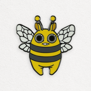 A whimsical, cartoon-style enamel Lemon Bee Pin of a cute "Lemon Bee" character designed by Amanda Louise Spayd, with large eyes and a friendly expression from Bindlewood Shop.
