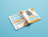 An open coloring book titled "Bindlewood Shop Morning Scribbles Coloring Book #3" resting on a solid blue background, showcasing playful creature illustrations on high-quality coloring paper ready to be colored.