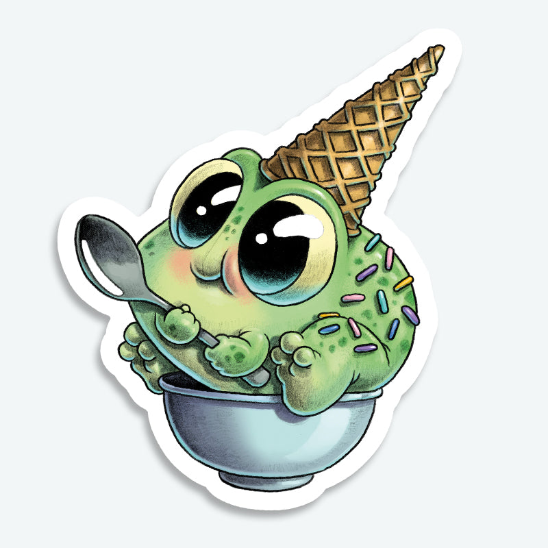 The Sprinkle Frog Sticker from Bindlewood Shop features a cute, cartoon green frog with sprinkles and an ice cream cone on its head, sitting in a bowl with a spoon—large shiny eyes and blush complete this sweet Chris Ryjniak-inspired design.