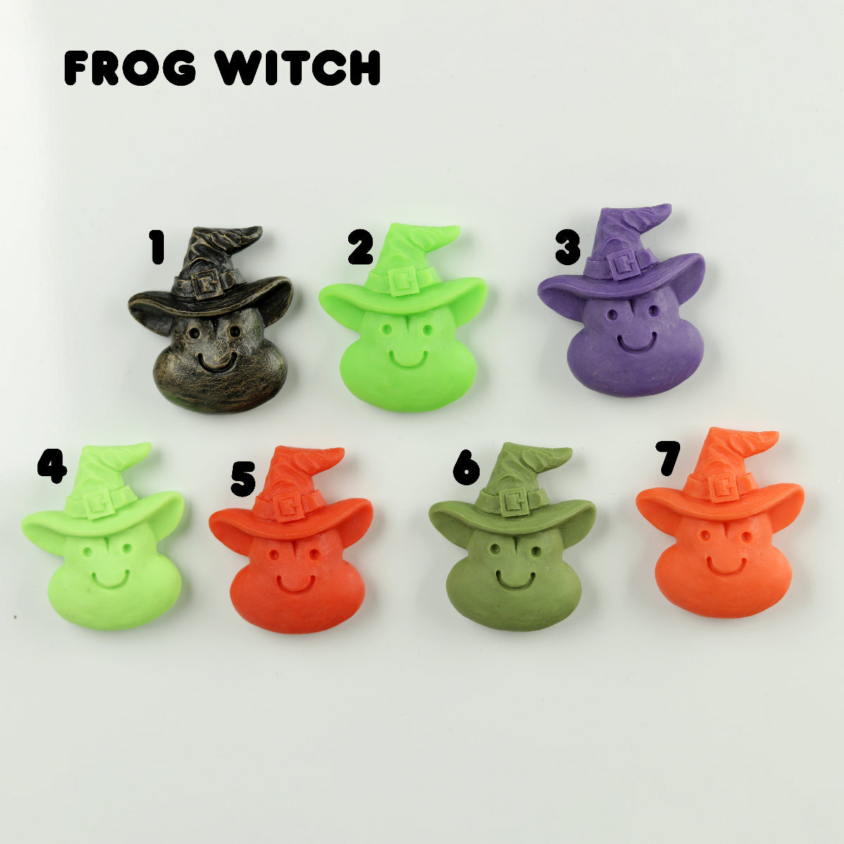 Set of seven frog-shaped witch figurines in various colors on a white background.