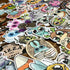 Brighten any space with the ULTRA MEGA STICKER PACK! from Bindlewood Shop—a delightful assortment of colorful vinyl stickers showcasing cute, big-eyed fantasy creatures, whimsical animals, and charming characters with expressive faces, all perfect for adding playful energy to your favorite surfaces.