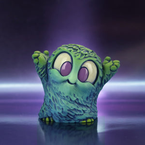 The Tidal Smurk by Chris Ryniak is a small, teal and green furry resin monster figure with big purple eyes and raised arms, standing on a reflective surface against a glowing purple background.