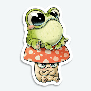 The Toad Stool Sticker (3-inch) from Bindlewood Shop features a cute green frog on a red-and-white mushroom with a grumpy stem. This whimsical vinyl sticker is perfect for fans of Amanda Louise Spayd’s pipsqueak creatures.