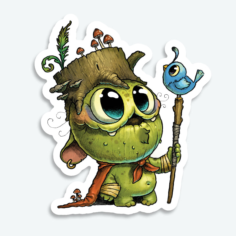 The Wood Wizard Sticker by Bindlewood Shop features a cute, green goblin-like creature with big eyes, a tree stump hat with mushrooms, red scarf, and staff topped with a blue bird. Durable matte finish vinyl—perfect for decorating!.
