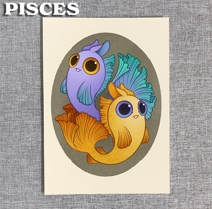 Zodiac Prints by Amanda Louise Spayd from Bindlewood Shop features two big-eyed cartoon fish, one purple and one yellow, swimming in an oval frame with "PISCES" in bold at the top left.