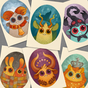 Zodiac Prints by Amanda Louise Spayd from Bindlewood Shop feature six whimsical, cartoon-style zodiac animals on archival paper—perfect fine art for any astrology lover.