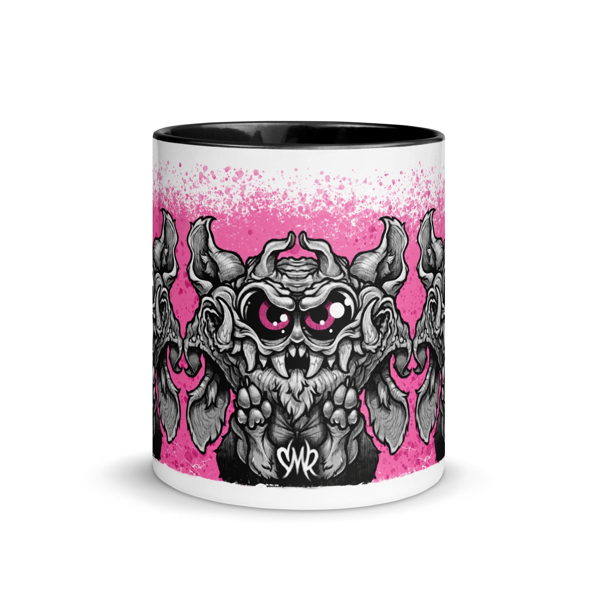 The Radbit Mug from Bindlewood Shop is a white ceramic mug with a black interior, showcasing a cartoonish, wide-eyed monster in shades of gray and black, accented with pink and displayed against a playful splatter background. Inspired by Chris Ryniak’s monster designs, the mug features the initials “SMR” below the central creature.