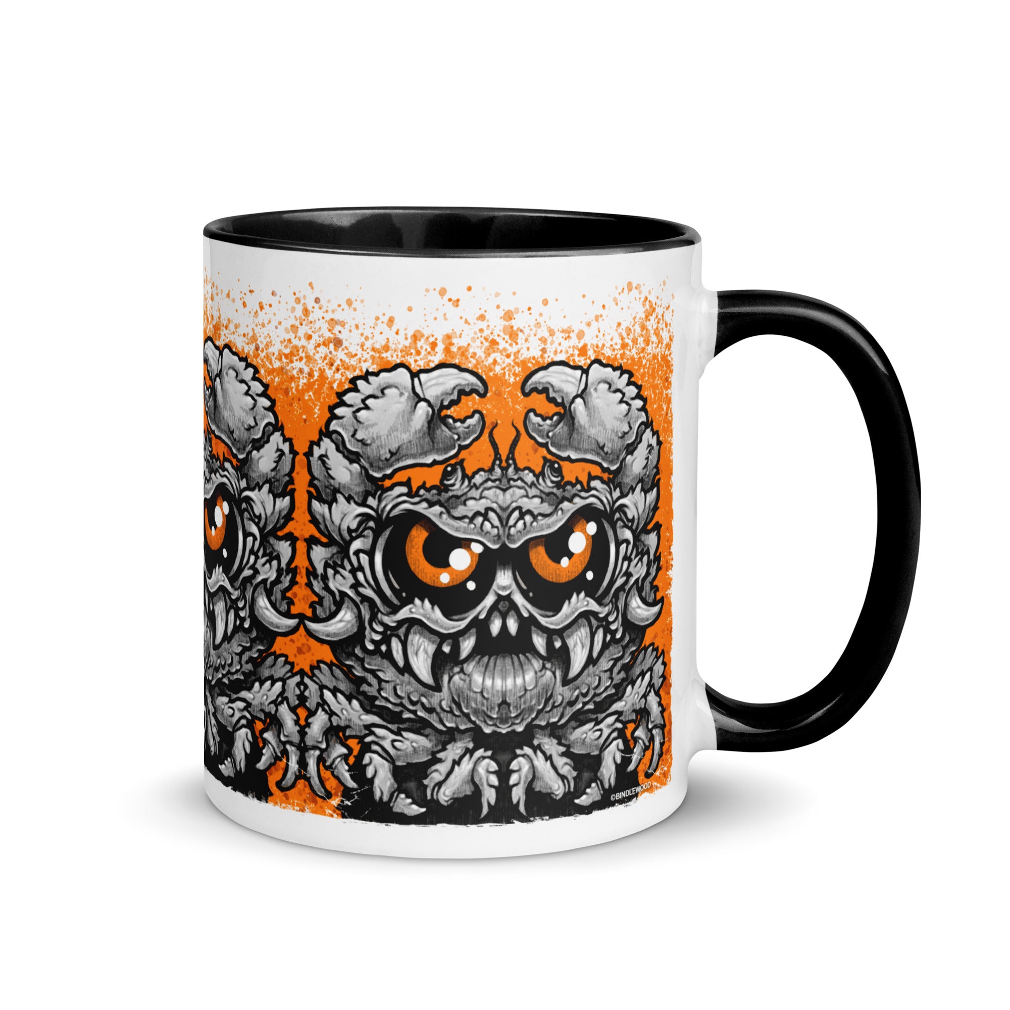 The Krabb Mug from Bindlewood Shop is a white ceramic mug with a black handle, showcasing a cartoonish angry crab with big claws, orange eyes, and sharp teeth against an orange splatter background—an ideal choice for fans of Chris Ryniak’s whimsical monster mug designs.