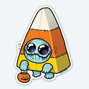 The Bindlewood Shop Candy Corn Suit Sticker (3-inch) features a cute blue monster with big eyes and fangs in a candy corn costume, holding a pumpkin bucket—printed on durable vinyl with a smooth matte finish.