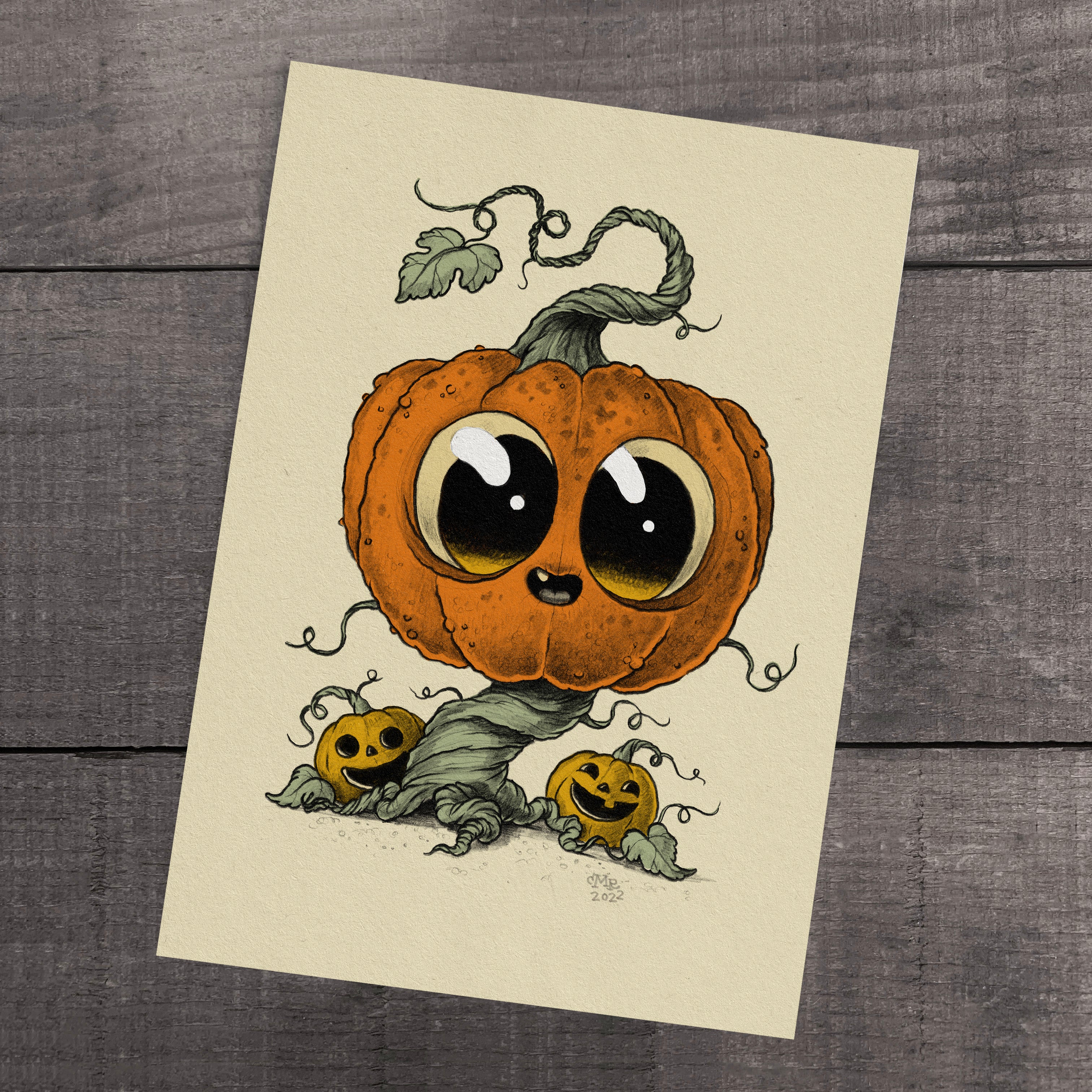 The "Vintage Vine" print by Chris Ryniak features a whimsical illustration of a large, cute pumpkin with big eyes and a smiling face perched on a twisting vine, accompanied by two smaller smiling pumpkins at the base against a wooden background. The cartoonish style is ideal for an archival paper fine art print.