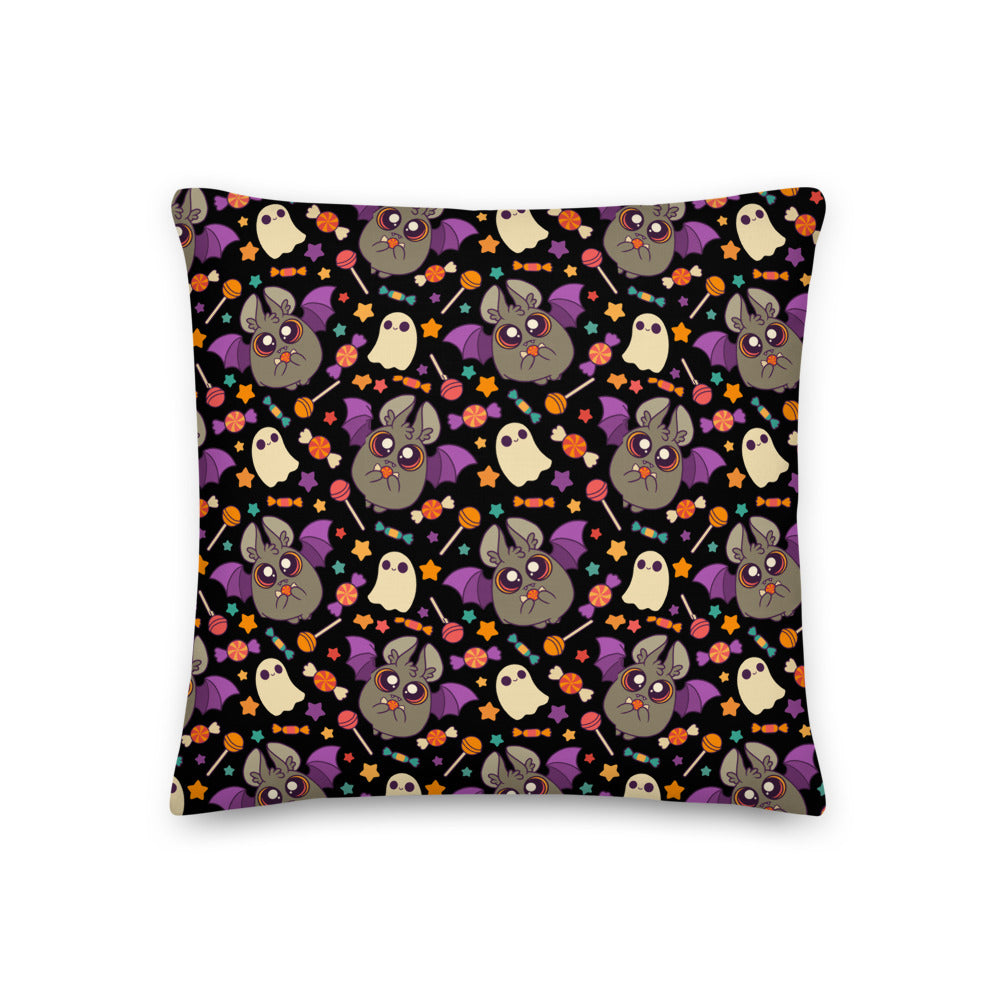 Introducing the Candy Bat Throw Pillow from Bindlewood Shop! This square pillow boasts a playful Halloween-themed design with cute cartoon bats sporting purple wings and wide eyes, smiling white ghosts, and small orange and red flowers scattered across a black background. Perfect for adding a touch of charm to your Spooky Season decor!