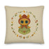 The Bindlewood Shop's Garden Sprite Throw Pillow is a charming rustic addition to any cottagecore interior design. It features a whimsical illustration of a large-eyed Garden Sprite wearing a red hood and green dress adorned with floral patterns. The character is surrounded by a circular arrangement of small flowers, leaves, and mushrooms, making it an enchanting accent piece for your home decor.