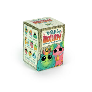 A vibrant "Thimblestump Hollow Series 2 - Single Blind Box" by Bindlewood Shop features cute cartoon creatures, with large green and pink characters on the front—an ideal collectible for blind box figure fans.