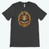 The dark gray tee from Bindlewood Shop features Amanda Louise Spayd's art of a grinning bunny in a gold frame with "The Maker" elegantly inscribed below, including large eyes and a suit.