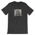 The Pipsqueak Mugshot Tee by Bindlewood Shop features a dark gray vintage design with a square cartoon rabbit mugshot and "POLICE DEPT 315154" sign, offering a comfortable, gender-neutral fit.
