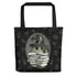 Bindlewood Shop’s Witchbunny Tote features a magical black cat in a witch hat with books and green magic, plus mystical symbols in the background—the perfect spellbook bag for essentials (and maybe Dust Bunnies). Original design.
