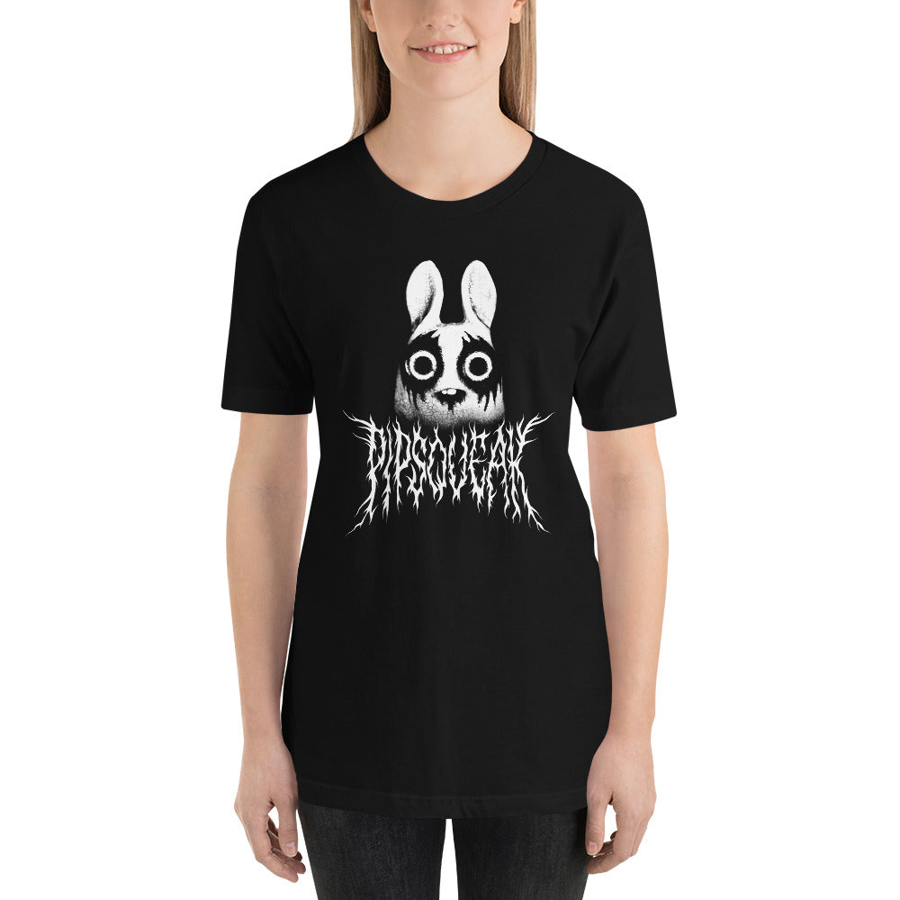 A person is wearing a Black Metal Pipsqueak Tee by Bindlewood Shop featuring a white cartoonish rabbit with wide eyes and a slightly unsettling expression. Below the rabbit, an intricate, spiky text design adds to the edgy aesthetic. The soft and lightweight T-shirt offers a comfortable, gender-neutral fit. The individual has long, straight hair and stands against a plain background.