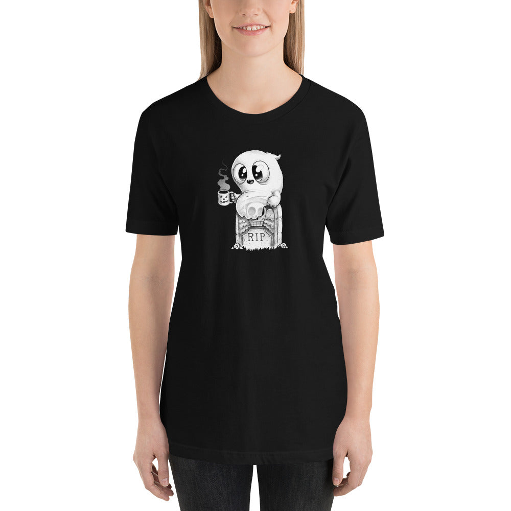 A person with long hair is wearing the cozy, black Good Mourning Tee from Bindlewood Shop, which features a cartoon ghost holding a coffee cup and sitting on a gravestone with "RIP" written on it. The gender-neutral fit shirt, which boasts a slight vintage look, is showcased against a plain white background.