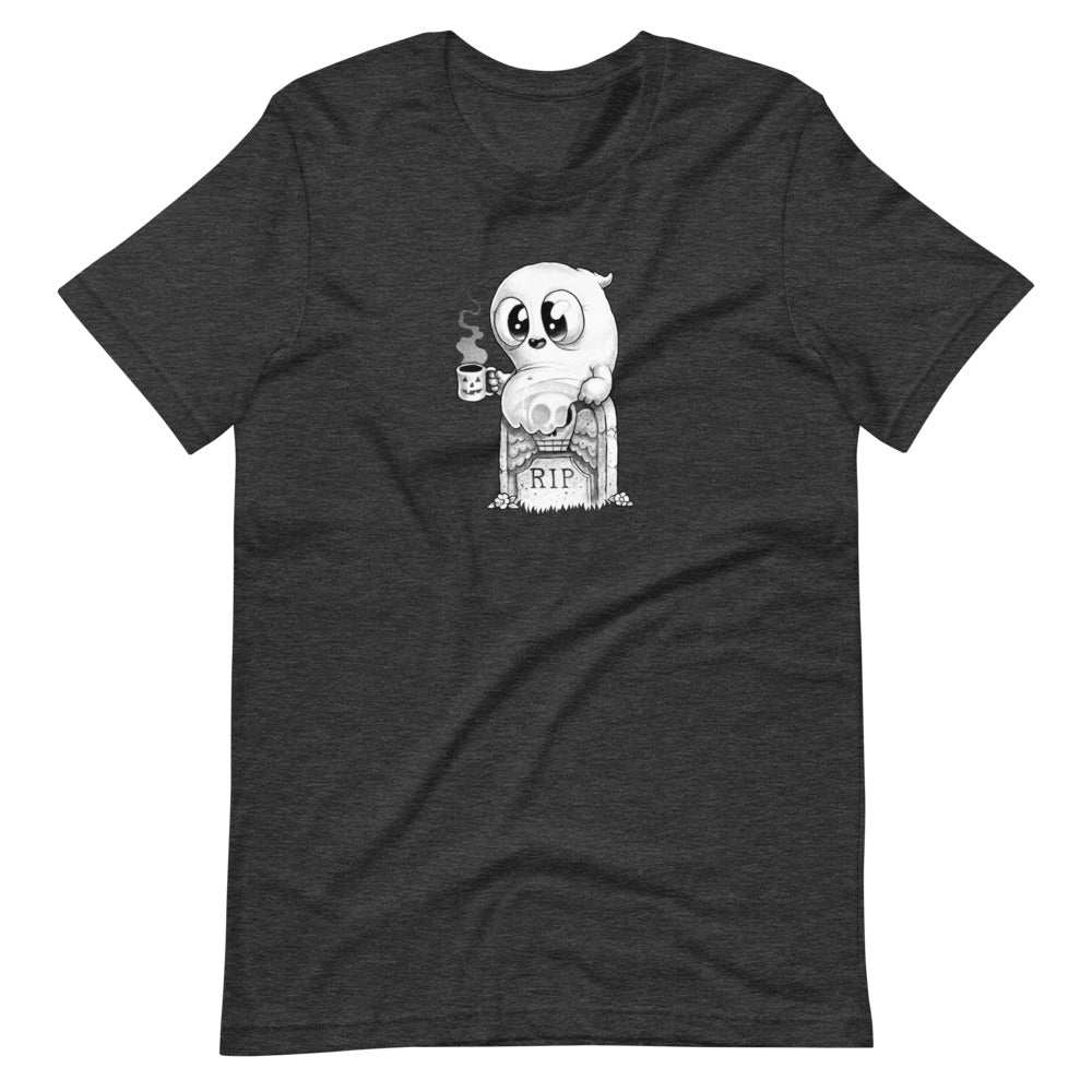 The Good Mourning Tee by Bindlewood Shop is a black T-shirt showcasing a cute ghost perched on a tombstone with "RIP" carved into it. The ghost is holding a steaming mug and has large, expressive eyes gazing off to the side. This cozy, gender-neutral shirt features a monochrome design that provides a playful, spooky vibe.