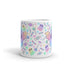 The "Pastel Candy Bat Mug" from Bindlewood Shop is a white ceramic mug adorned with a colorful pattern featuring bats with pastel wings, ghosts, candies, and stars. The design showcases soft pastel shades such as pink, purple, green, and blue, contributing to its whimsical and playful charm. Additionally, it is both microwave safe and dishwasher safe for your convenience.